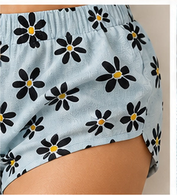Close-up showing narrow elasticated shorts leg hem fitted close to the thigh on LOMEE's floral co-ord set