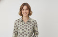 LOMEE women's grey-beige cotton polka dot shirt, front model view; brown dots with pale yellow striped accents