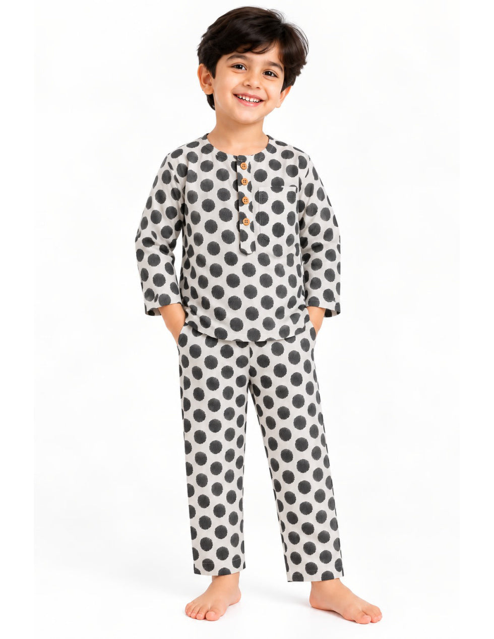 Light grey kids' cotton night suit with black polka dots, upright front product photo